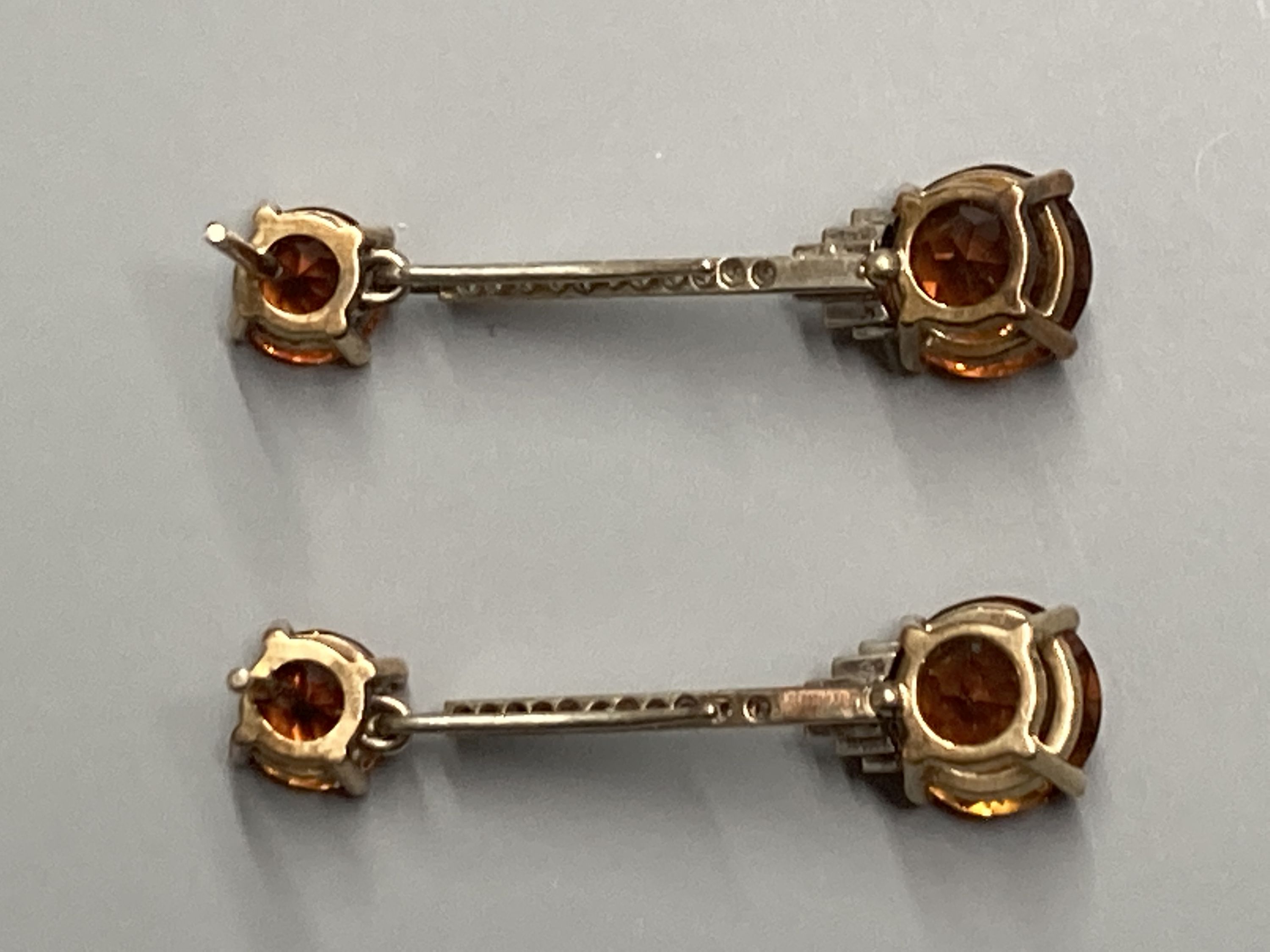 A pair of Art Deco style yellow and white metal, citrine and diamond chip set drop earrings, (no butterflies), 32mm, gross weight 3.8 grams.